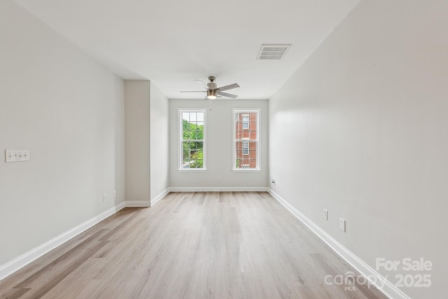 1126 Dean Hall Ln, Matthews, NC 28105 - spare room with light wood finished floors, ceiling fan, and baseboards