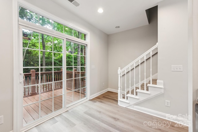 1126 Dean Hall Ln, Matthews, NC 28105 - entryway with wood finished floors, baseboards, stairway, and recessed lighting