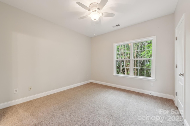1126 Dean Hall Ln, Matthews, NC 28105 - spare room featuring carpet floors, ceiling fan, and baseboards