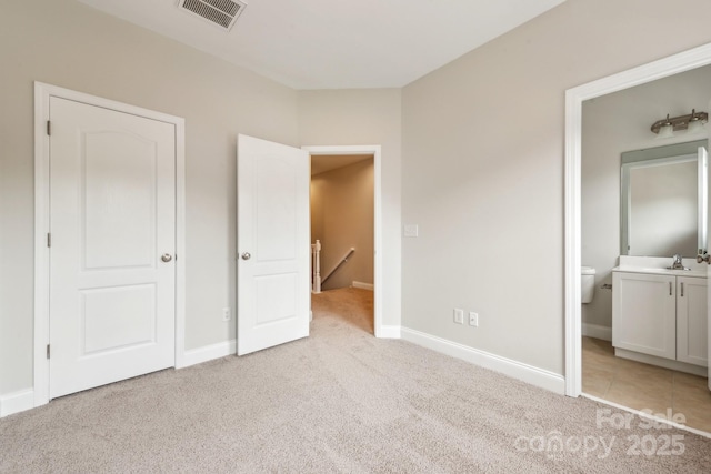 1126 Dean Hall Ln, Matthews, NC 28105 - unfurnished bedroom with light colored carpet, baseboards, and ensuite bathroom