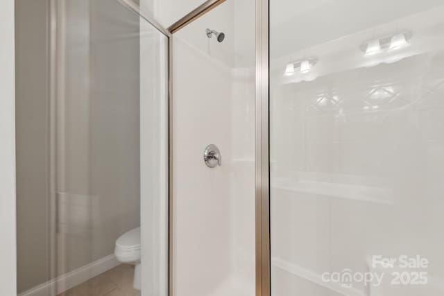 1126 Dean Hall Ln, Matthews, NC 28105 - bathroom with a shower stall, toilet, and tile patterned floors