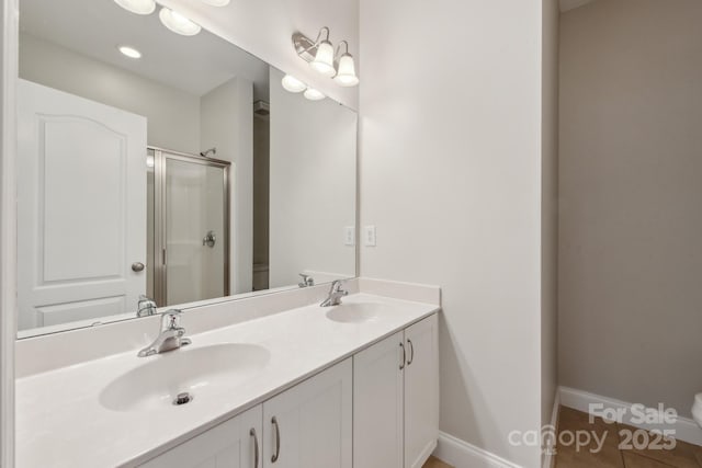 1126 Dean Hall Ln, Matthews, NC 28105 - bathroom featuring toilet, a shower stall, double vanity, and baseboards