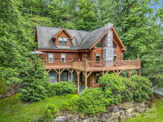 120 Rocky Mountain Dr, Lake Lure, NC 28746 - view of front of home with log siding, a deck, and a chimney