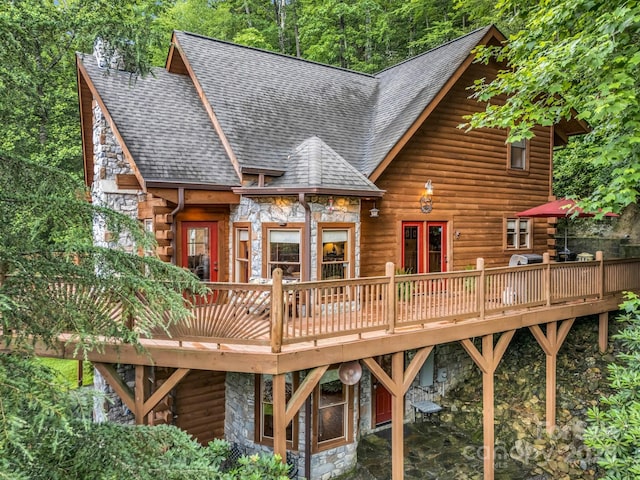 120 Rocky Mountain Dr, Lake Lure, NC 28746 - rear view of house with stone siding, a shingled roof, a wooden deck, and log siding