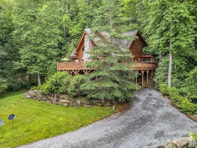 120 Rocky Mountain Dr, Lake Lure, NC 28746 - view of front of property with a forest view, a deck, and a front lawn