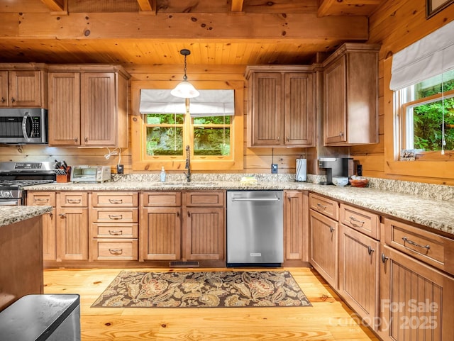 120 Rocky Mountain Dr, Lake Lure, NC 28746 - kitchen featuring stainless steel appliances, a wooden ceiling with exposed beams, light wood-style flooring, pendant lighting, and light stone countertops