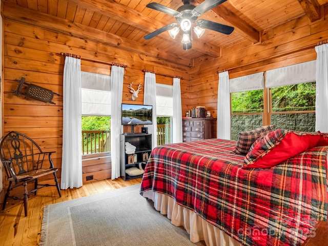 120 Rocky Mountain Dr, Lake Lure, NC 28746 - bedroom with a wooden ceiling with exposed beams, hardwood / wood-style floors, wood walls, and ceiling fan