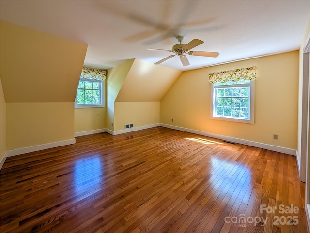 355 Rosewood Ln, Burnsville, NC 28714 - bonus room featuring plenty of natural light, wood-type flooring, vaulted ceiling, a ceiling fan, and baseboards