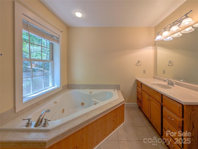 355 Rosewood Ln, Burnsville, NC 28714 - bathroom with healthy amount of natural light, vanity, a tub with jets, and tile patterned flooring