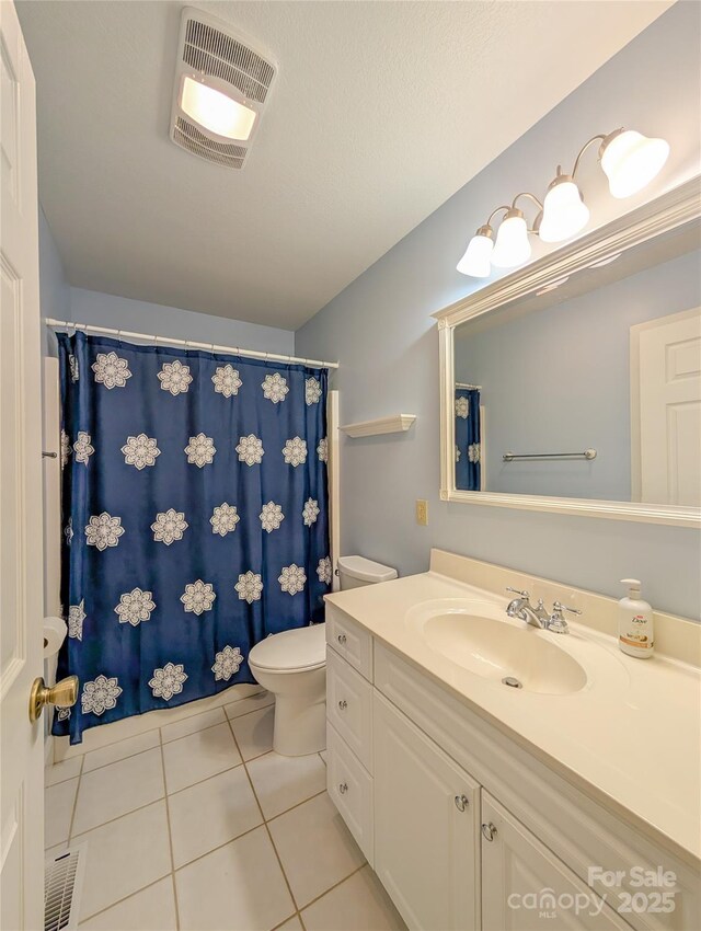 355 Rosewood Ln, Burnsville, NC 28714 - bathroom featuring toilet, vanity, tile patterned floors, and curtained shower