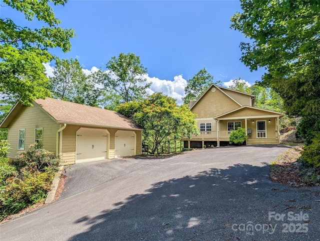 355 Rosewood Ln, Burnsville, NC 28714 - view of front of property featuring a garage and driveway