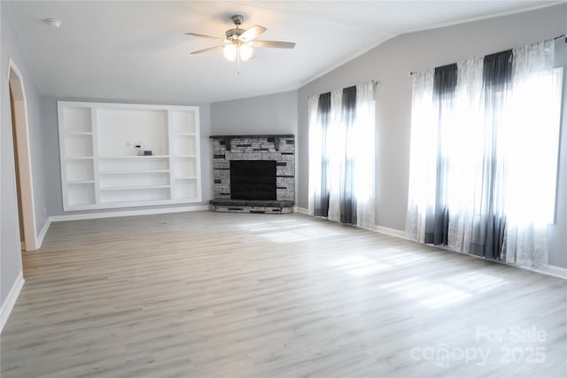1184 Sherwood Rd, Clover, SC 29710 - unfurnished living room with healthy amount of natural light, a ceiling fan, arched walkways, baseboards, and vaulted ceiling