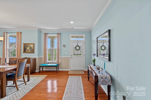 7339 Millstone Cir SW, Concord, NC 28025 - entryway featuring crown molding, light wood-type flooring, and baseboards