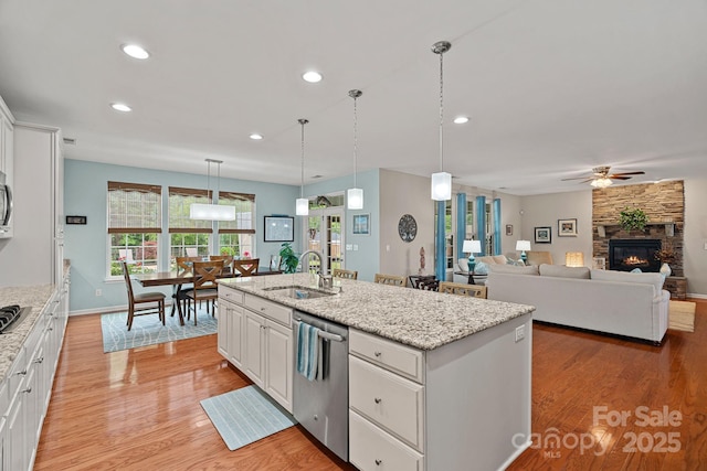 7339 Millstone Cir SW, Concord, NC 28025 - kitchen featuring stainless steel appliances, a sink, ceiling fan, light wood-style flooring, and recessed lighting