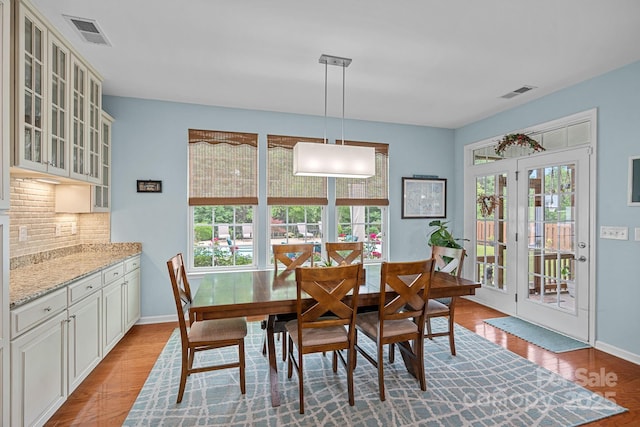 7339 Millstone Cir SW, Concord, NC 28025 - dining room featuring baseboards and light wood-type flooring