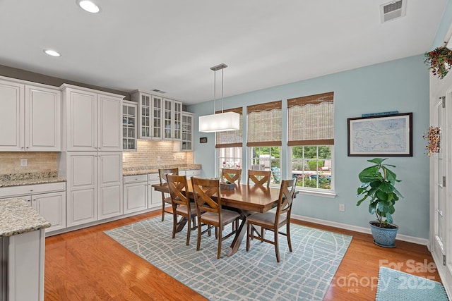 7339 Millstone Cir SW, Concord, NC 28025 - dining room with light wood-type flooring, recessed lighting, and baseboards