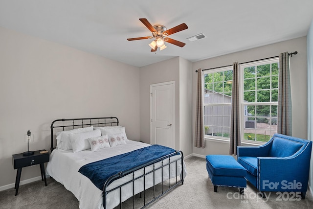 7339 Millstone Cir SW, Concord, NC 28025 - bedroom featuring baseboards, carpet floors, and a ceiling fan