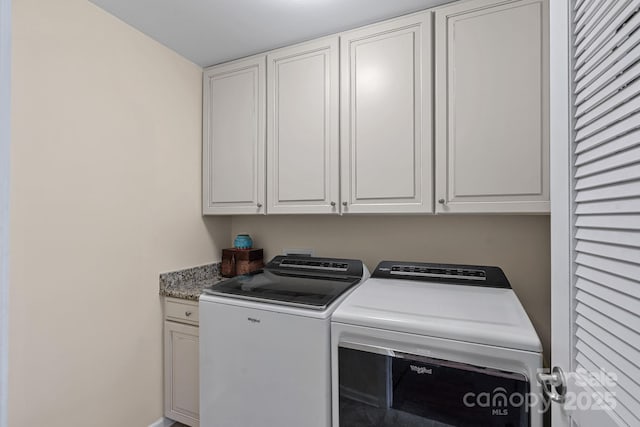 7339 Millstone Cir SW, Concord, NC 28025 - laundry area with washer and clothes dryer and cabinet space