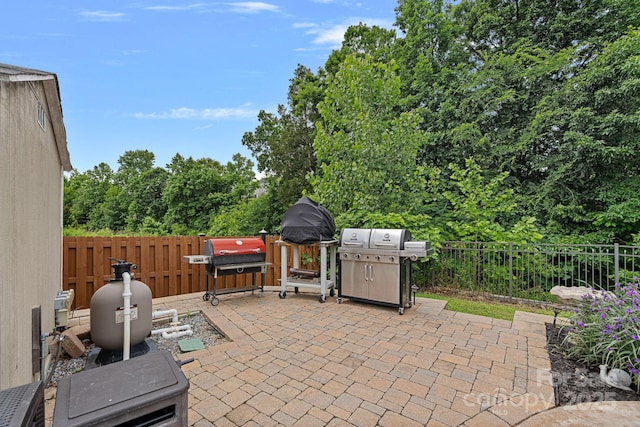 7339 Millstone Cir SW, Concord, NC 28025 - fenced backyard with a patio and grilling area