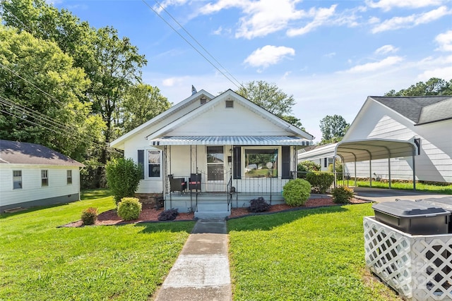 302 N St, Morganton, NC 28655 - bungalow featuring a front lawn, a detached carport, and covered porch