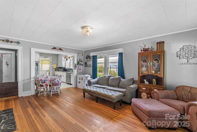 302 N St, Morganton, NC 28655 - living area with light wood-style flooring and crown molding