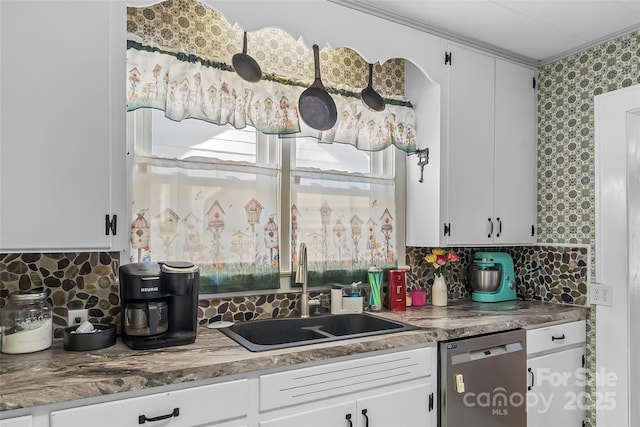 302 N St, Morganton, NC 28655 - kitchen with stainless steel dishwasher, a sink, white cabinets, tasteful backsplash, and crown molding