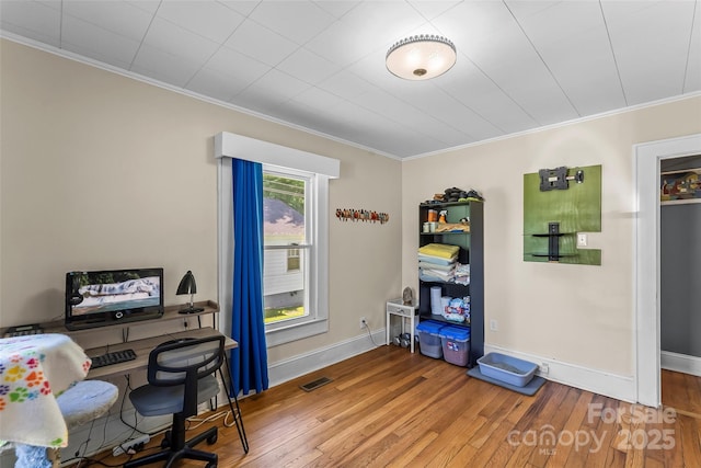 302 N St, Morganton, NC 28655 - office area with crown molding, wood-type flooring, and baseboards