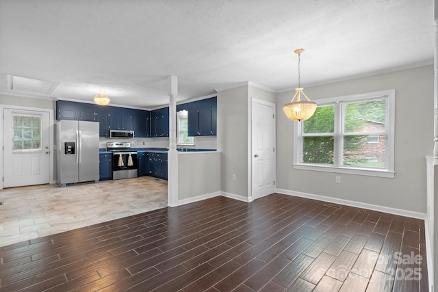 352 18th Ave NE, Hickory, NC 28601 - kitchen with blue cabinetry, appliances with stainless steel finishes, baseboards, light countertops, and crown molding