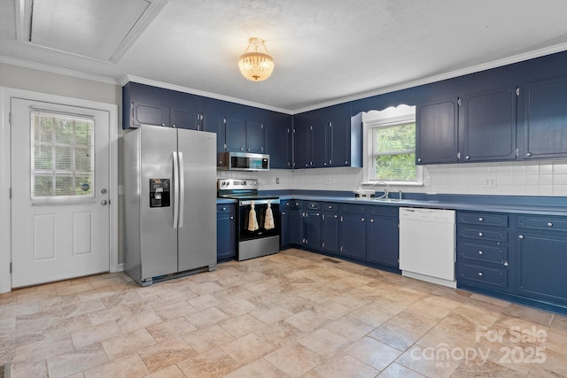 352 18th Ave NE, Hickory, NC 28601 - kitchen with appliances with stainless steel finishes, decorative backsplash, blue cabinetry, and crown molding