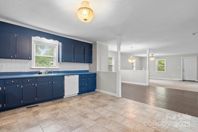 352 18th Ave NE, Hickory, NC 28601 - kitchen featuring white dishwasher, a sink, blue cabinets, decorative backsplash, and baseboards
