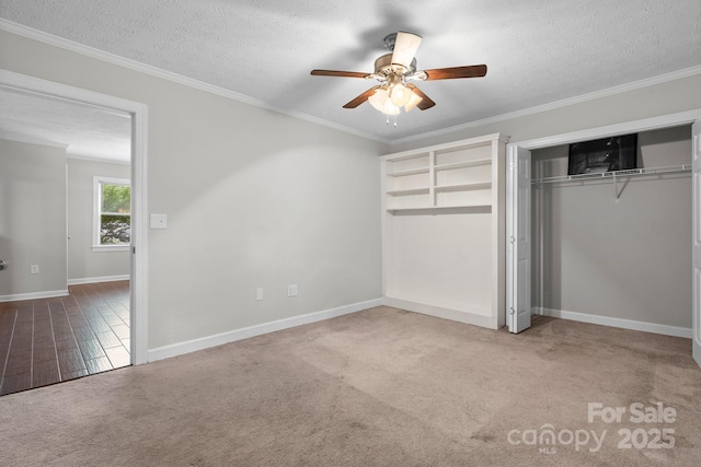 352 18th Ave NE, Hickory, NC 28601 - unfurnished bedroom featuring baseboards, carpet, a closet, a textured ceiling, and ornamental molding