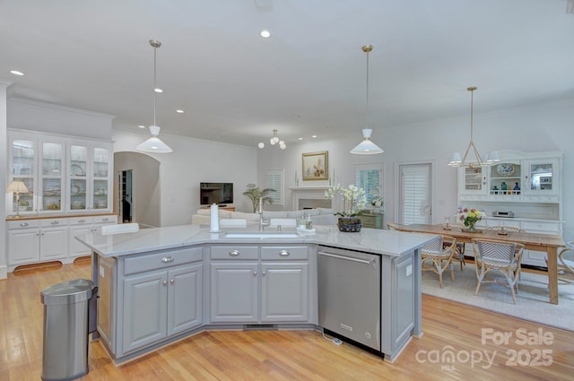 4323 Rosecliff Dr, Charlotte, NC 28277 - kitchen featuring stainless steel dishwasher, light wood-style floors, light stone countertops, white cabinetry, and open floor plan