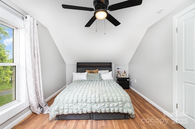12504 Culp Rd, Gold Hill, NC 28071 - bedroom featuring lofted ceiling, wood finished floors, and a ceiling fan