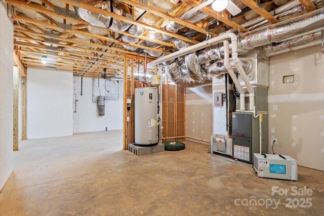 311 Carriage Crest Dr, Hendersonville, NC 28791 - unfinished basement with water heater and a central vacuum unit