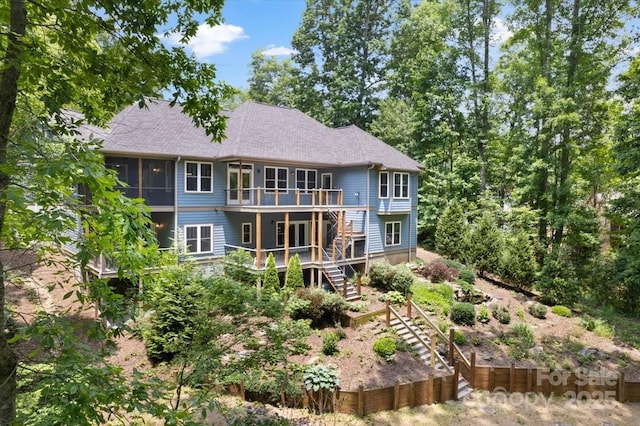 311 Carriage Crest Dr, Hendersonville, NC 28791 - rear view of house with stairs, a deck, and a shingled roof
