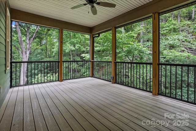 311 Carriage Crest Dr, Hendersonville, NC 28791 - unfurnished sunroom with a ceiling fan and a view of trees