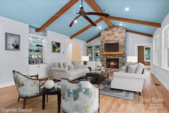 311 Carriage Crest Dr, Hendersonville, NC 28791 - living room featuring wood finished floors, ceiling fan, built in features, a stone fireplace, and recessed lighting