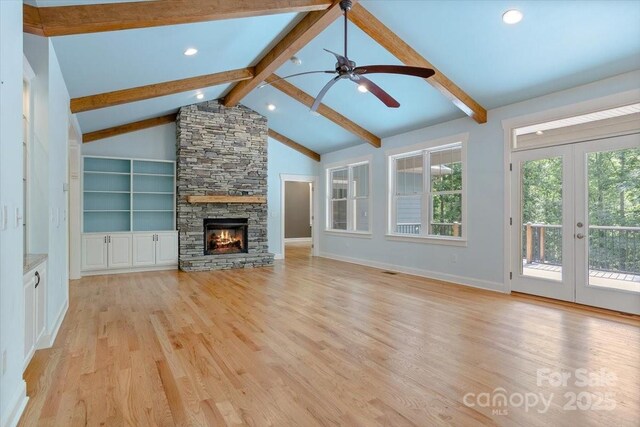 311 Carriage Crest Dr, Hendersonville, NC 28791 - unfurnished living room with healthy amount of natural light, light wood-style flooring, ceiling fan, recessed lighting, and a fireplace