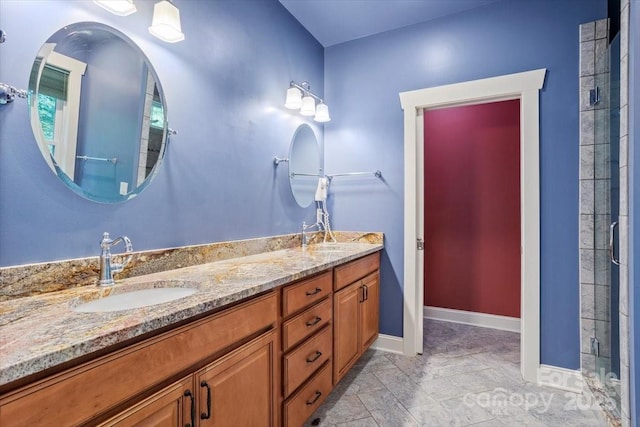 311 Carriage Crest Dr, Hendersonville, NC 28791 - bathroom with double vanity, tiled shower, and baseboards