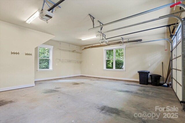 311 Carriage Crest Dr, Hendersonville, NC 28791 - garage featuring a garage door opener and baseboards