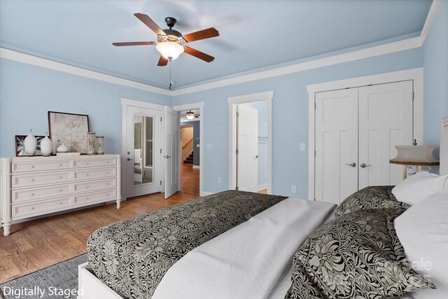 311 Carriage Crest Dr, Hendersonville, NC 28791 - bedroom with wood finished floors, a ceiling fan, and a closet