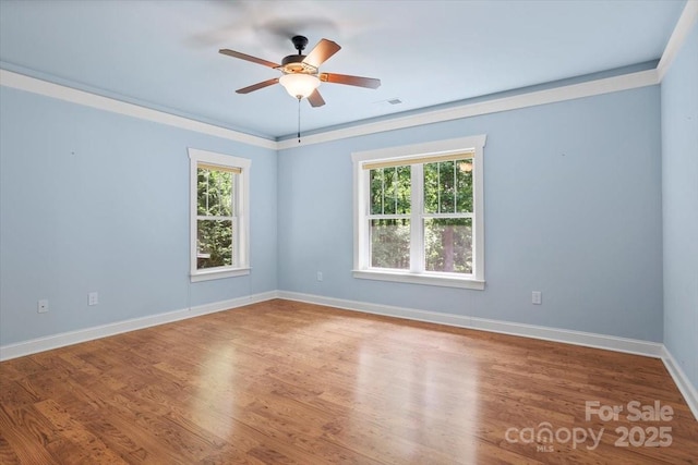 311 Carriage Crest Dr, Hendersonville, NC 28791 - spare room with plenty of natural light, baseboards, ceiling fan, and wood finished floors