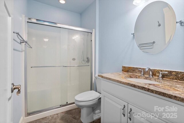 311 Carriage Crest Dr, Hendersonville, NC 28791 - full bath featuring vanity, a shower stall, and toilet