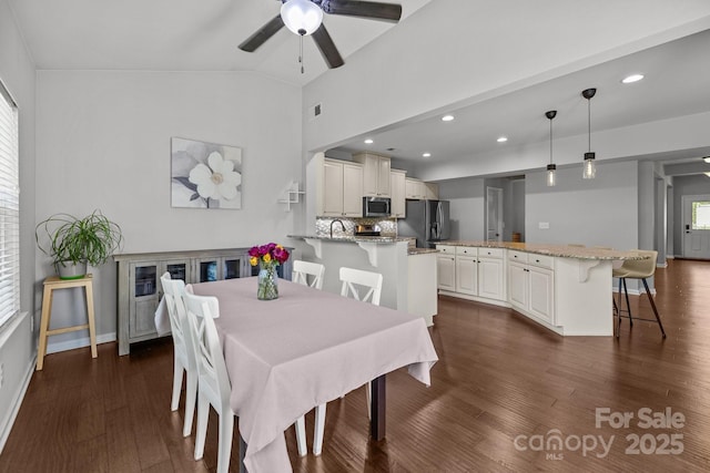 1300 Yellow Springs Dr, Indian Land, SC 29707 - dining area featuring ceiling fan, dark wood-type flooring, lofted ceiling, recessed lighting, and baseboards