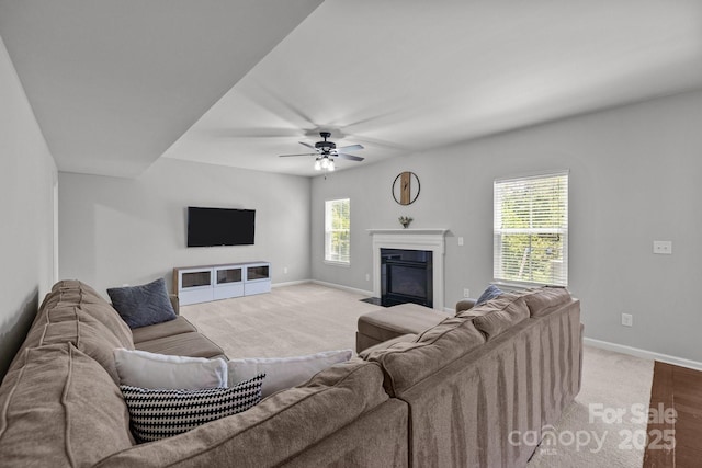 1300 Yellow Springs Dr, Indian Land, SC 29707 - living area featuring baseboards, ceiling fan, a glass covered fireplace, and carpet floors