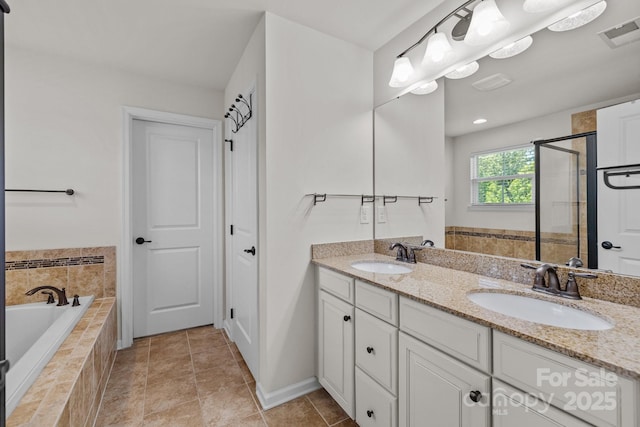 1300 Yellow Springs Dr, Indian Land, SC 29707 - full bath featuring double vanity, a bath, a shower stall, and baseboards