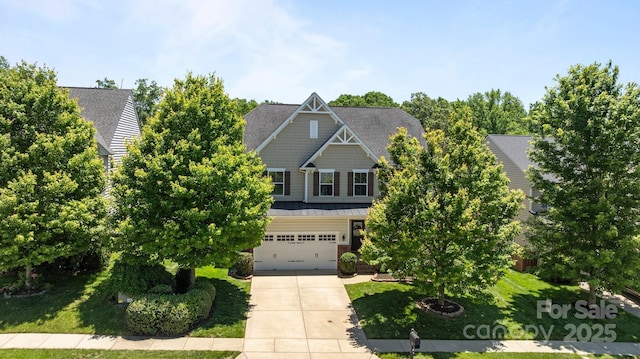 1300 Yellow Springs Dr, Indian Land, SC 29707 - view of front facade with concrete driveway, an attached garage, and a front lawn