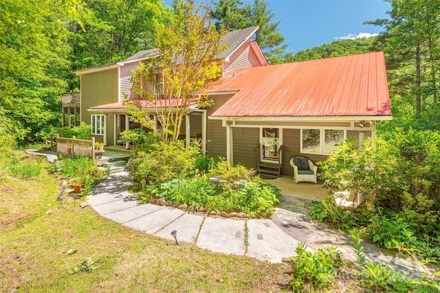 14 Shelton Branch Rd, Barnardsville, NC 28709 - rear view of property featuring metal roof and a patio