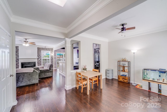 11714 Harsworth Ln, Charlotte, NC 28277 - dining space with ceiling fan, wood-type flooring, a large fireplace, and crown molding