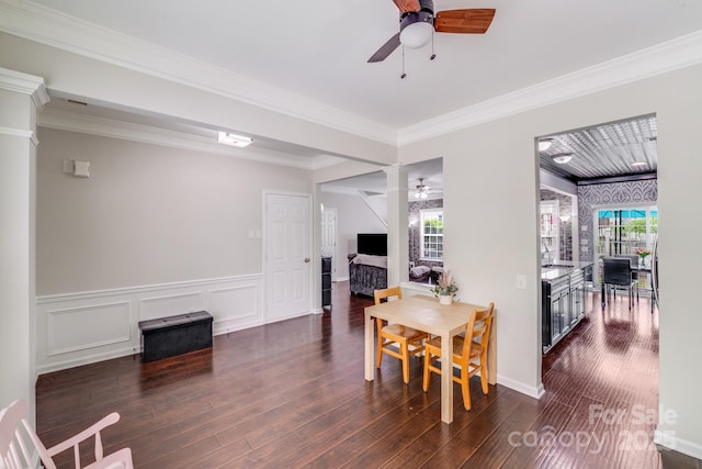 11714 Harsworth Ln, Charlotte, NC 28277 - dining room with a ceiling fan, dark wood-type flooring, ornamental molding, and wainscoting